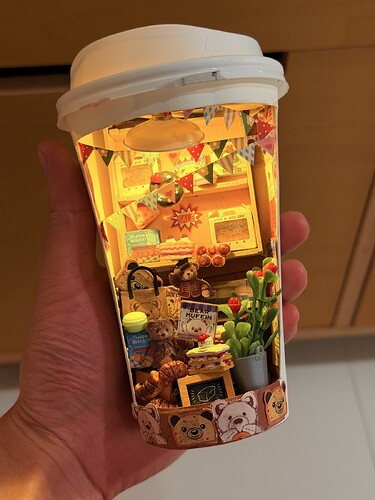 handheld glowing coffee cup miniature