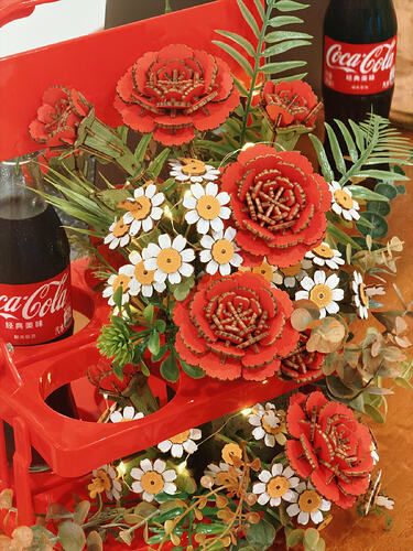 close-up of the Coca-Cola and ROWOOD flower basket