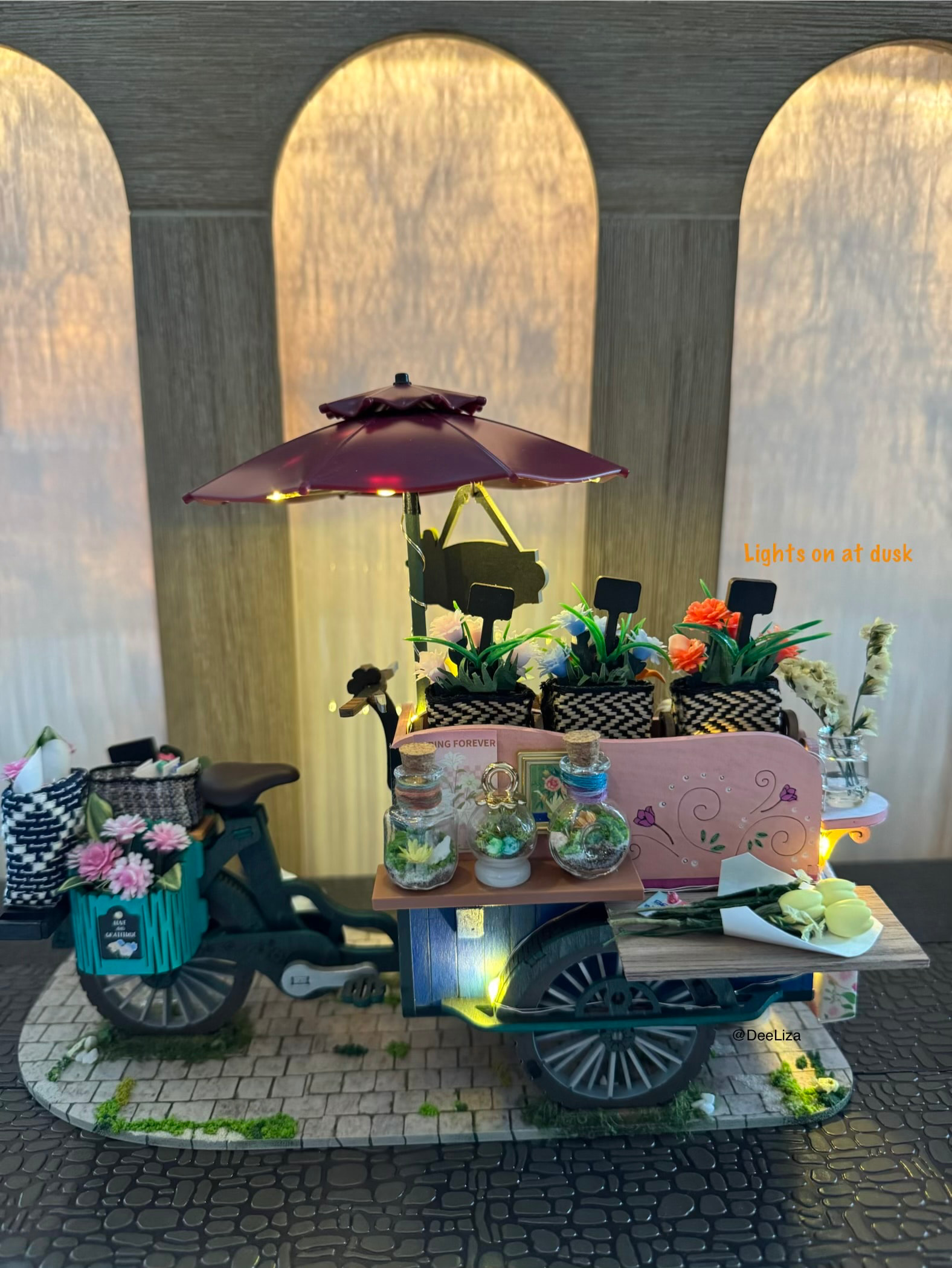 Warm night lighting across the customized flower display