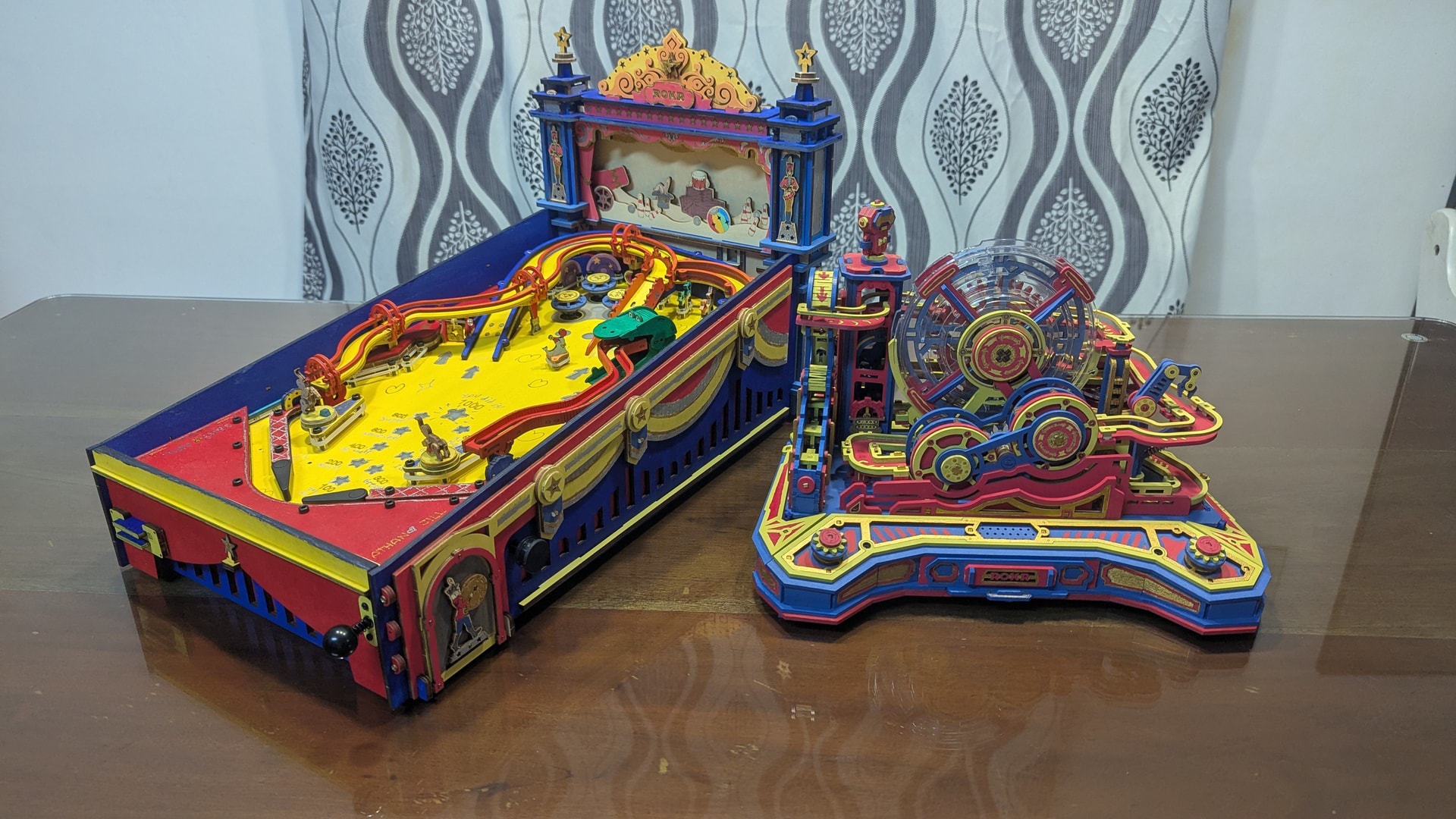 Jill's customized ROKR Pinball Machine displayed beside the family's matching painted Gear Ball Challenge